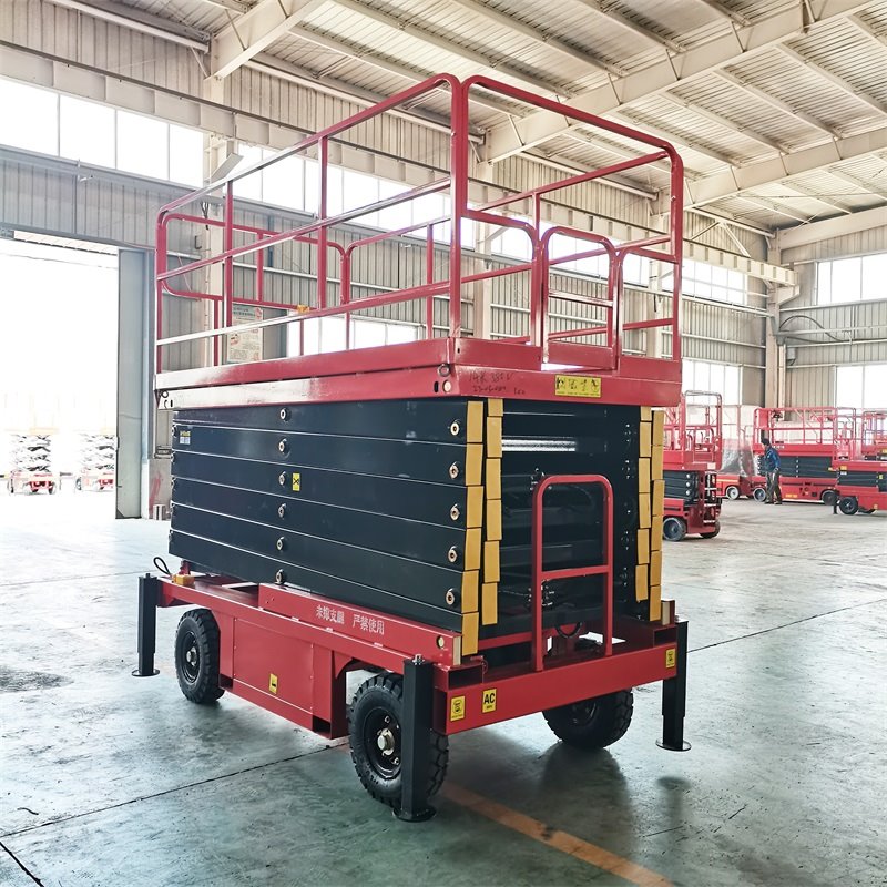Sollevatore a forbice trainabile con piattaforma estensibile